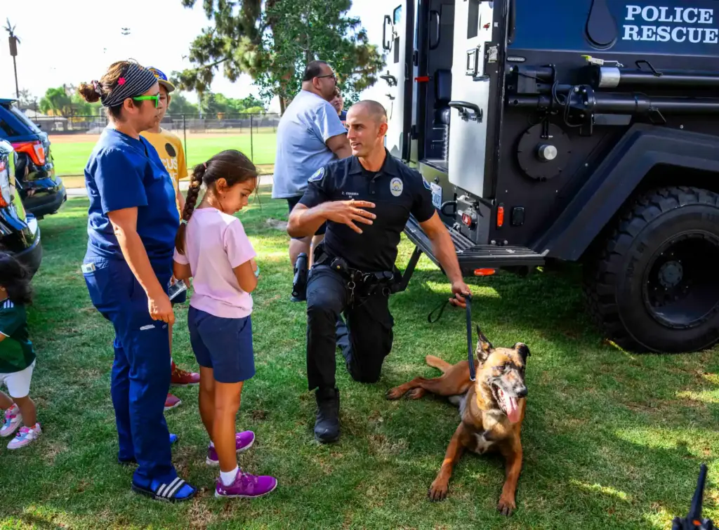 Santa Ana canine officer Zach Esquerra and his canine partner...