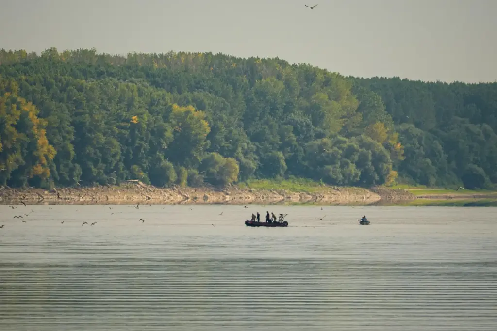 Romanian Navy EOD specialists survey the area before a controlled...