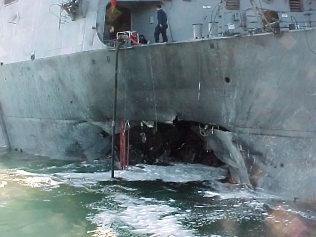 Port side view showing the damage sustained by the USS Cole.