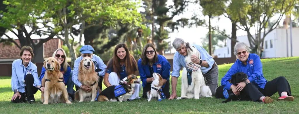 Kris Bonham, left, Chrissie Emmel with her Golden Retriever, Freddie,...