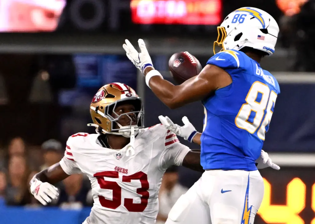 Chargers tight end Oronde Gadsden, right, drops a pass as...