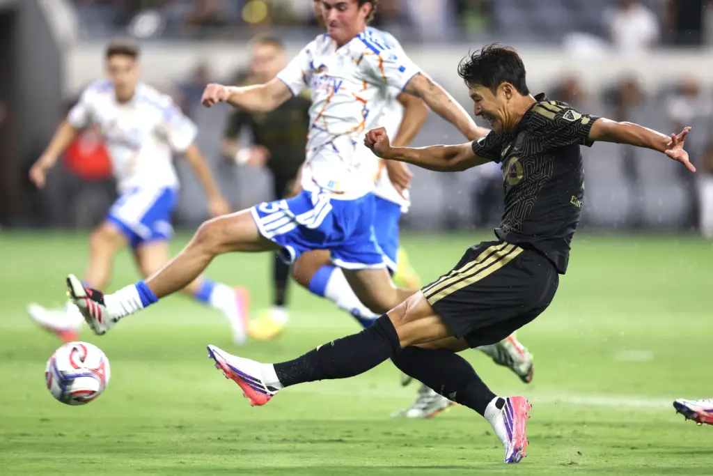 Los Angeles FC forward Son Heung-Min, front, takes a goal...