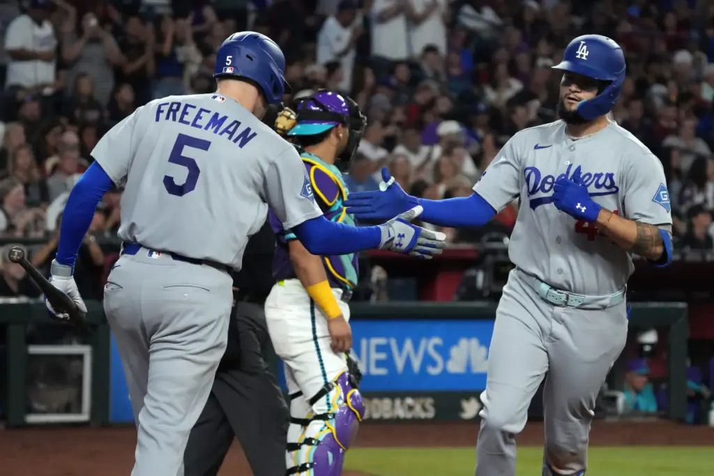 The Dodgers’ Andy Pages, right, celebrates with teammate Freddie Freeman...