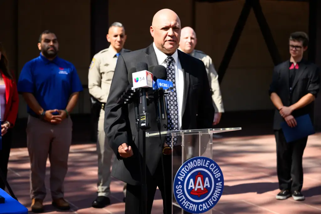 LAPD Detective Ryan Moreno speaks at a press conference held...