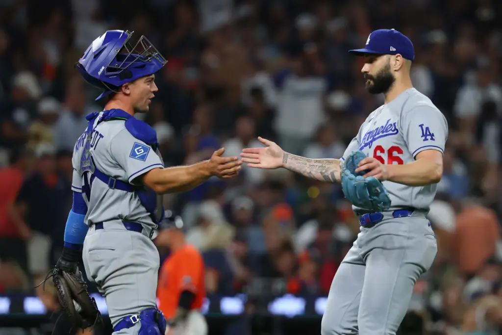 Dodgers relief pitcher Tanner Scott, right, celebrates with catcher Hunter...