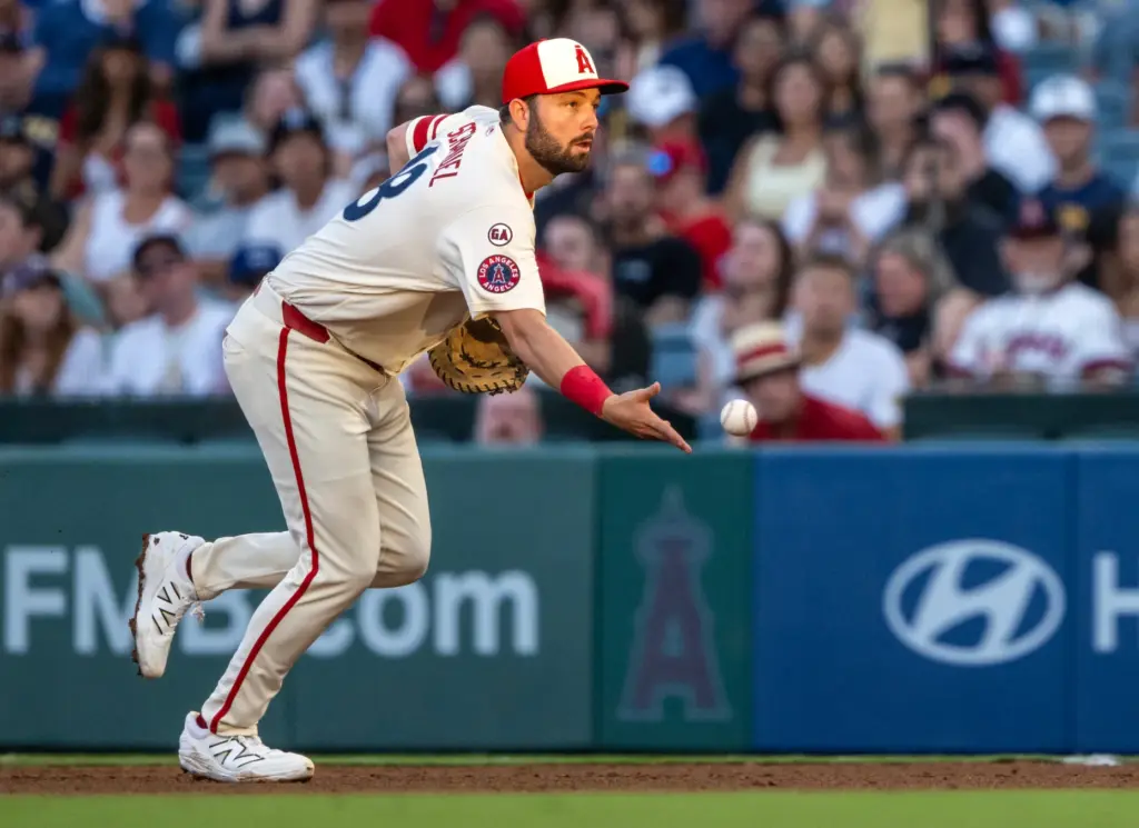 Angels first baseman Nolan Schanuel (18) tosses the ball to...