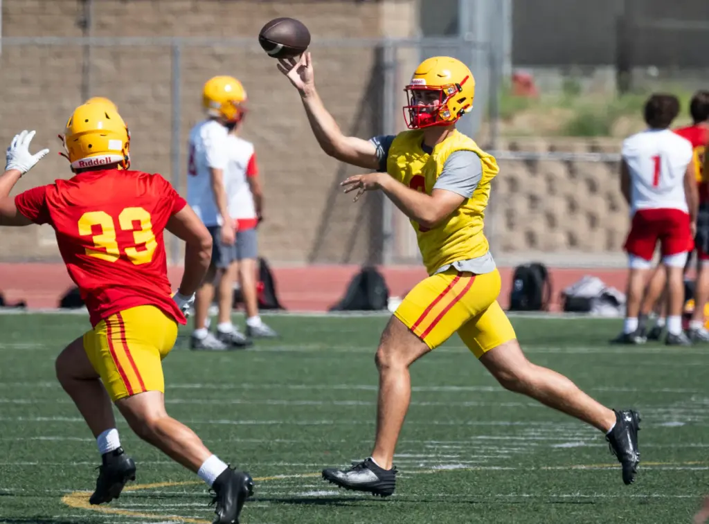 Mission Viejo High School quarterback Brett Burnor practices with the...