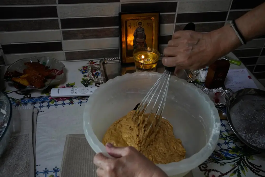 Maria Chanioti, 66, prepares Fanouropita, an orange-flavored cake.