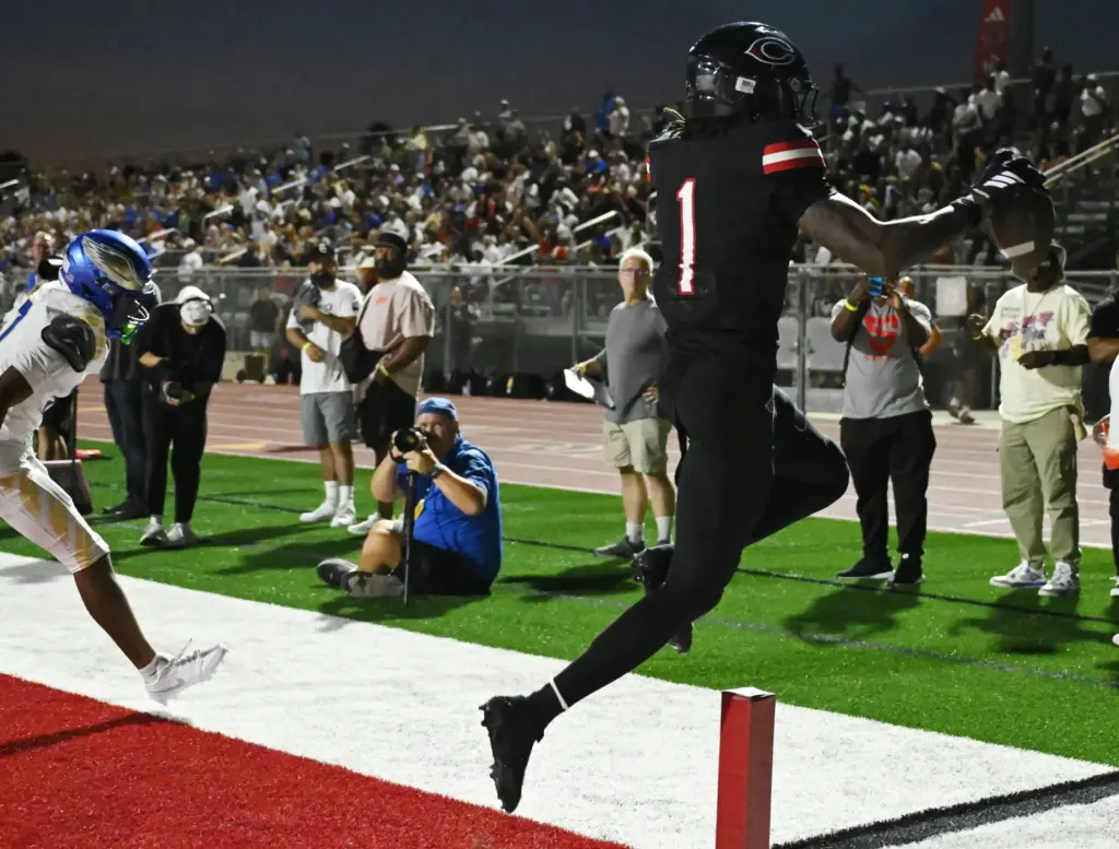 Centennial wide receiver Quentin Hale (1) makes the touch down...