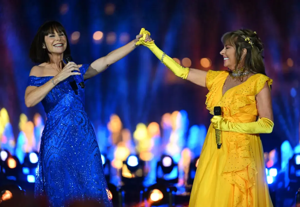 Paige O’Hara, animated Belle, and Susan Egan, original Belle on...