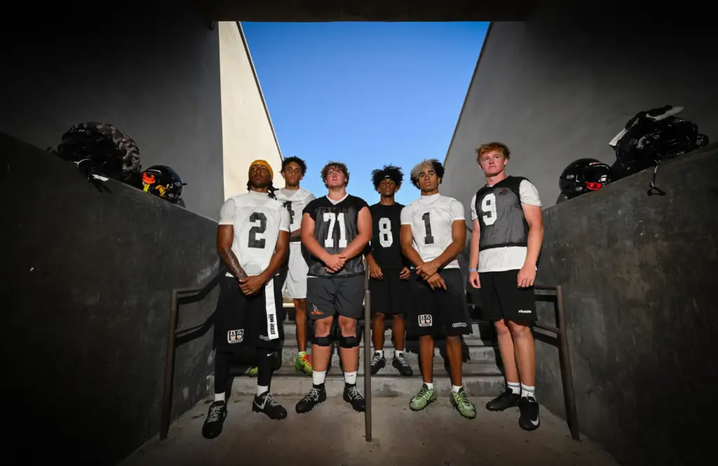 Huntington Beach High School football players Dylin Bruce, left, Gianni...