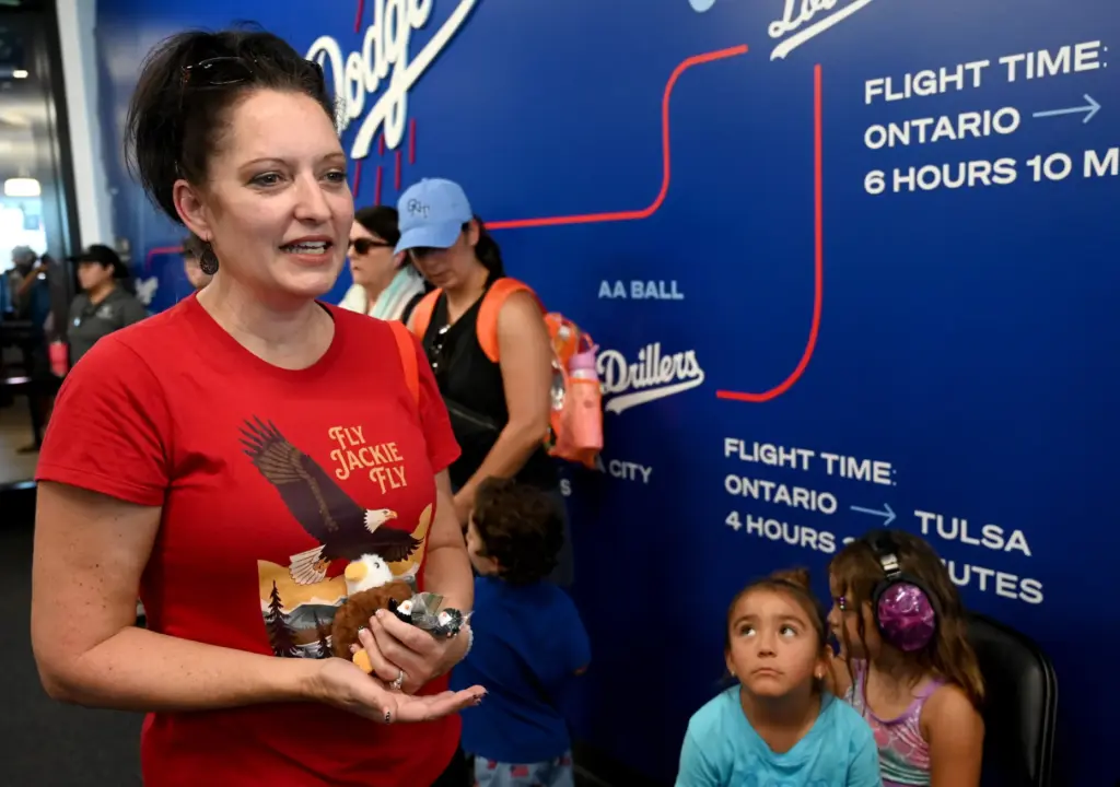 Corona resident, Stephanie Gotts, talks to the media about following...