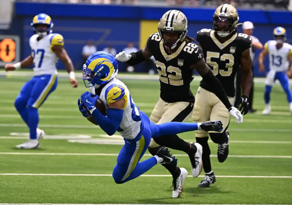 Rams wide receiver Tyler Scott (82) catches a pass for...