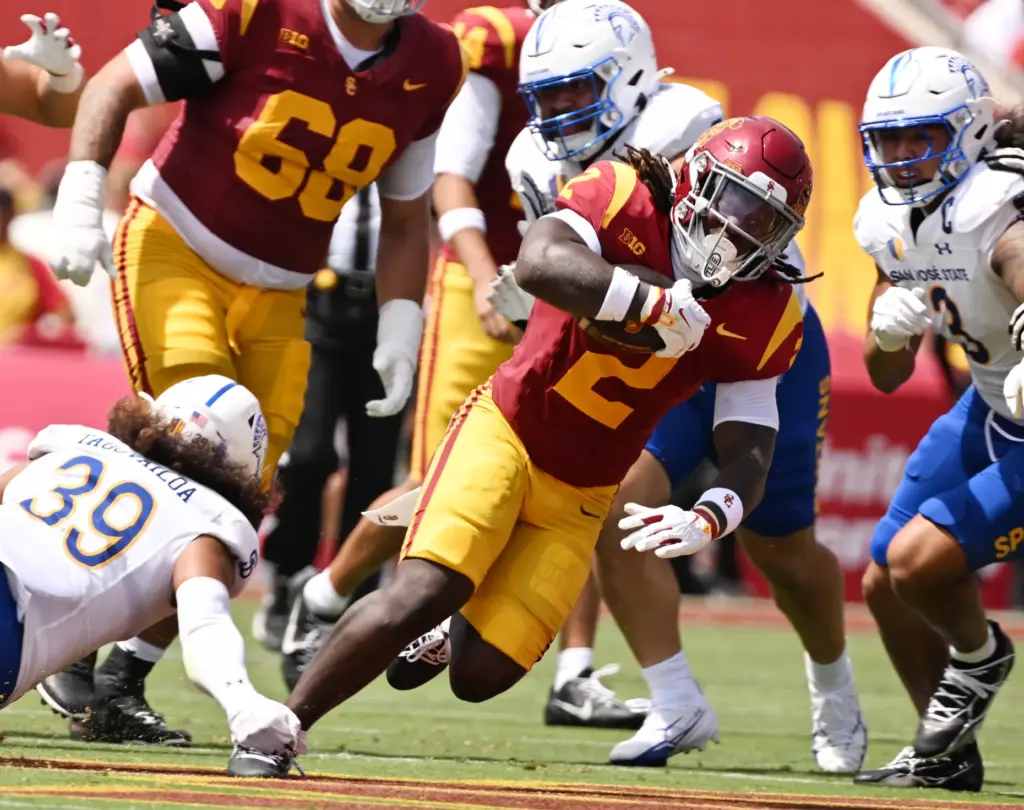 Running back Waymond Jordan (2) of the USC Trojans runs...