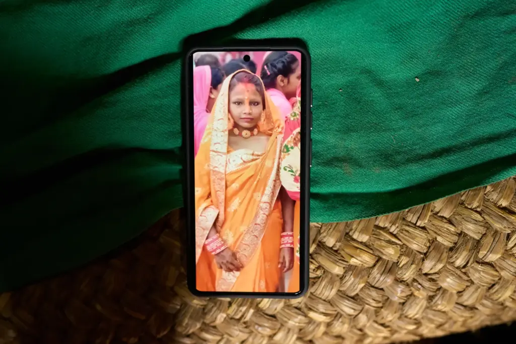 A photo of Kabita Mukhiya, who died during pregnancy, is displayed on a phone.