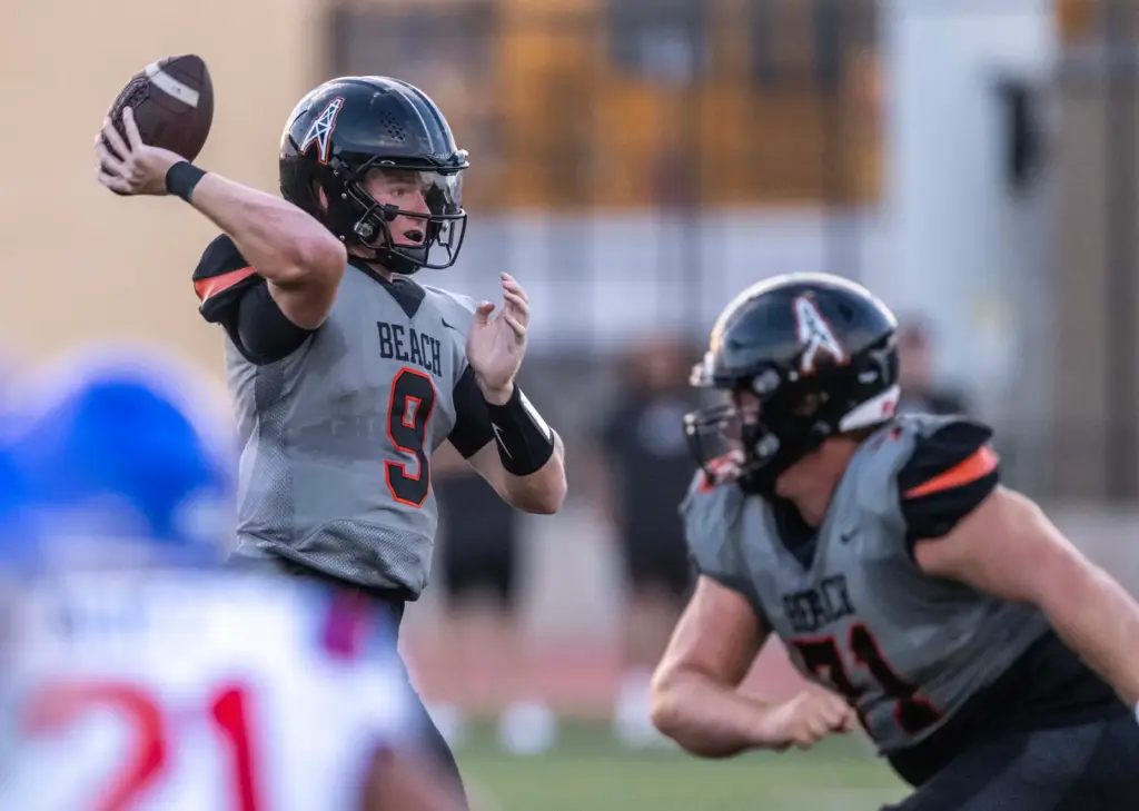Huntington Beach quarterback Brady Edmunds (9) throws the ball during...