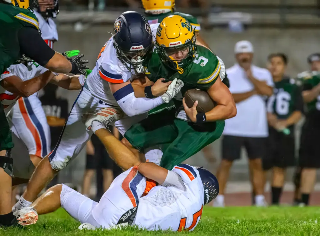 Brea Olinda quarterback Gavyn Nicholson is sacked by Cypress defensive...