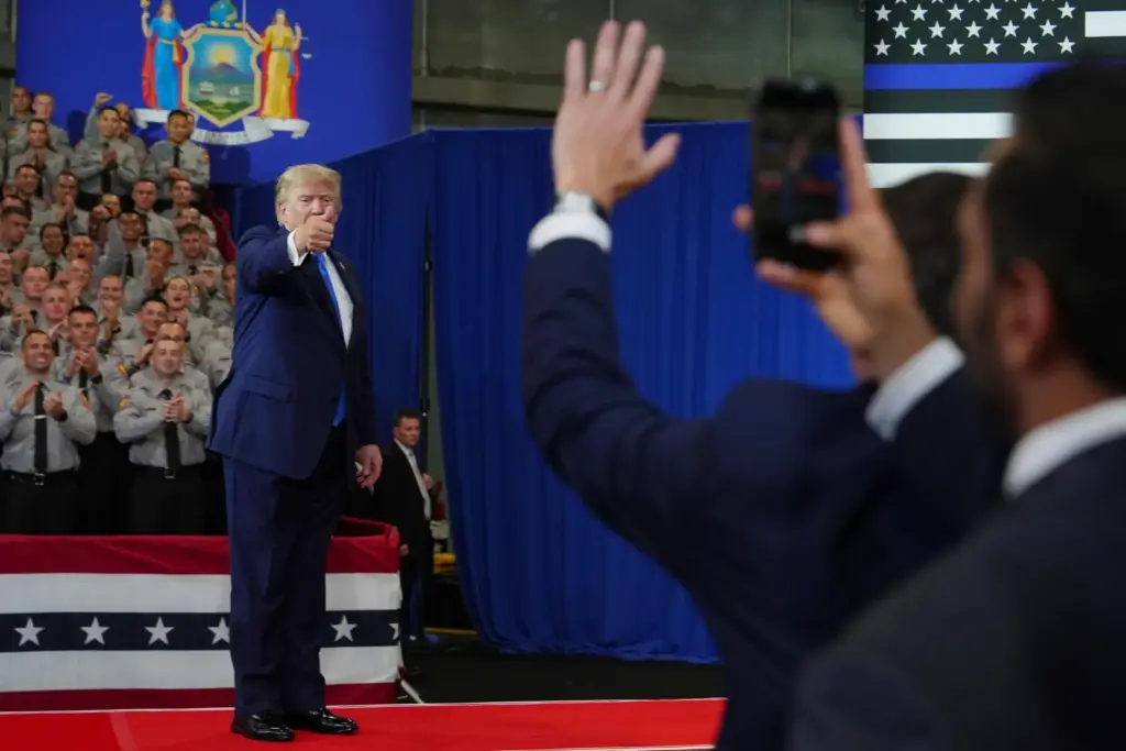 President Donald Trump departs as FBI Director Kash Patel, right,...