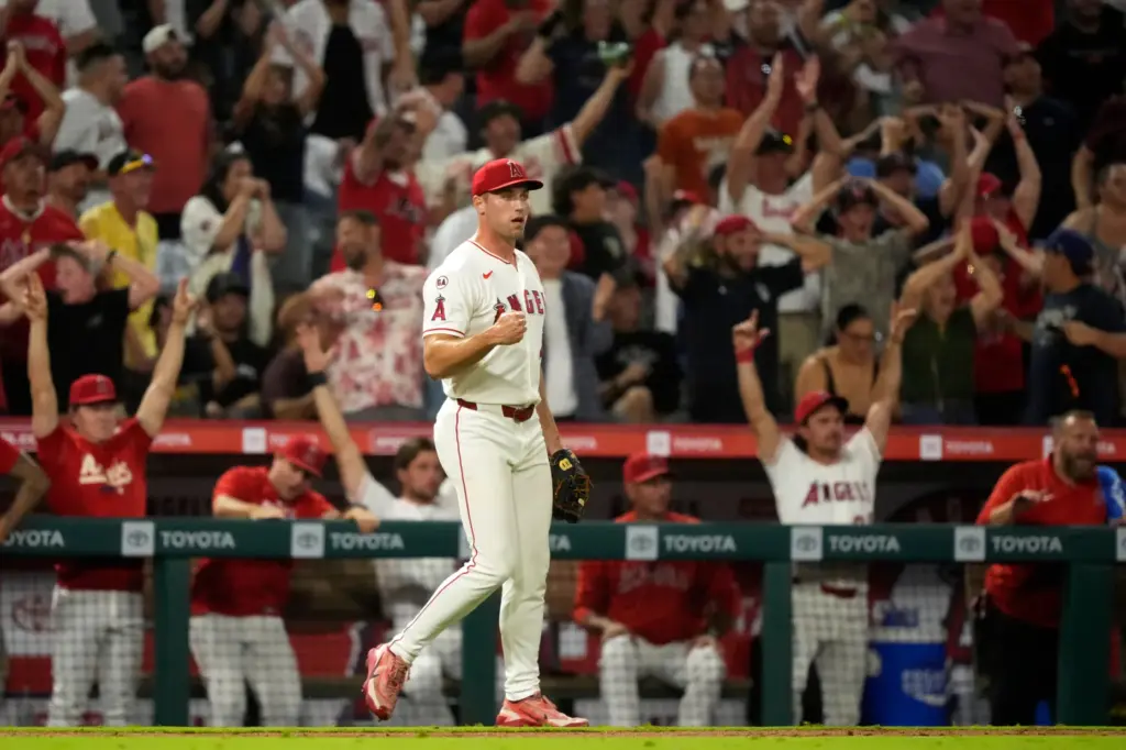 Angels relief pitcher Ben Joyce celebrates after right fielder Wade...