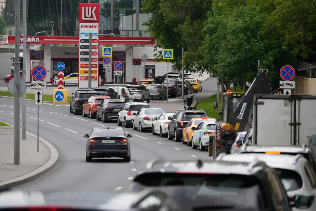 Cars line up at a Lukoil gas station in Moscow.