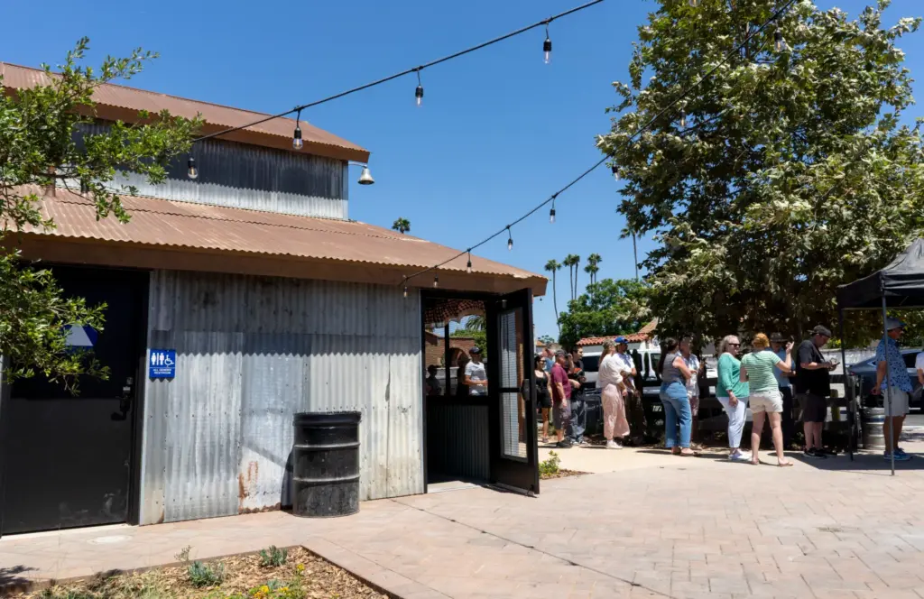 The line to order food at Heritage Barbecue stretches past...
