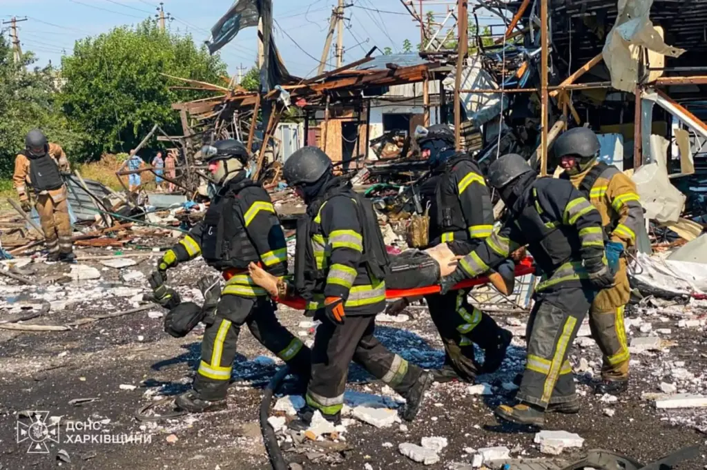 Rescuers carry a body that they removed from under the rubble.