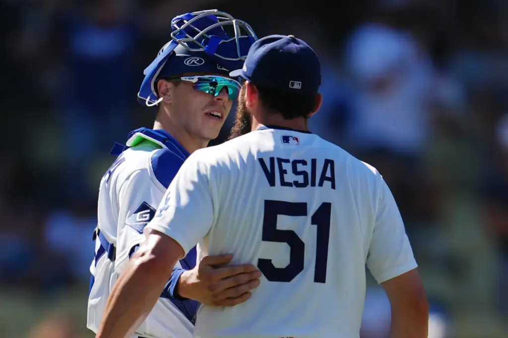 Dodgers catcher Hunter Feduccia, left, congratulates pitcher Alex Vesia after...