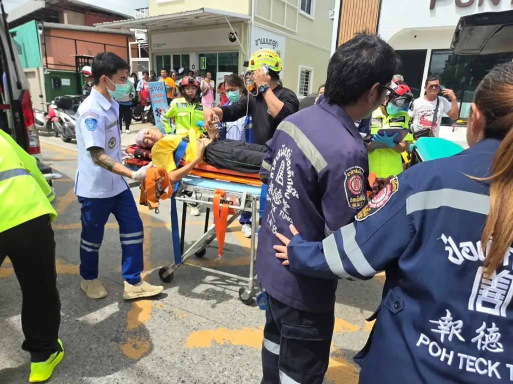 An injured person is carried on a stretcher after a school shooting in Thailand.