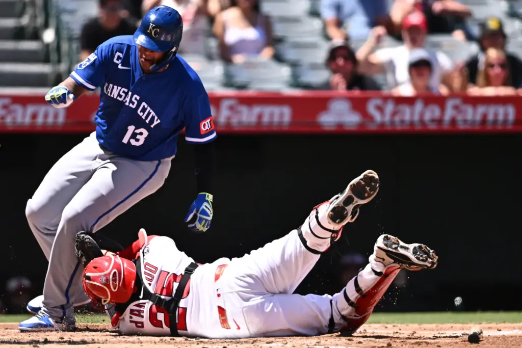 Kansas City Royals’ Salvador Perez (13) is forced out at...