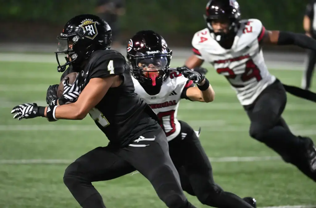 Serviteâs Jorden Wells (4) runs for a first down as...