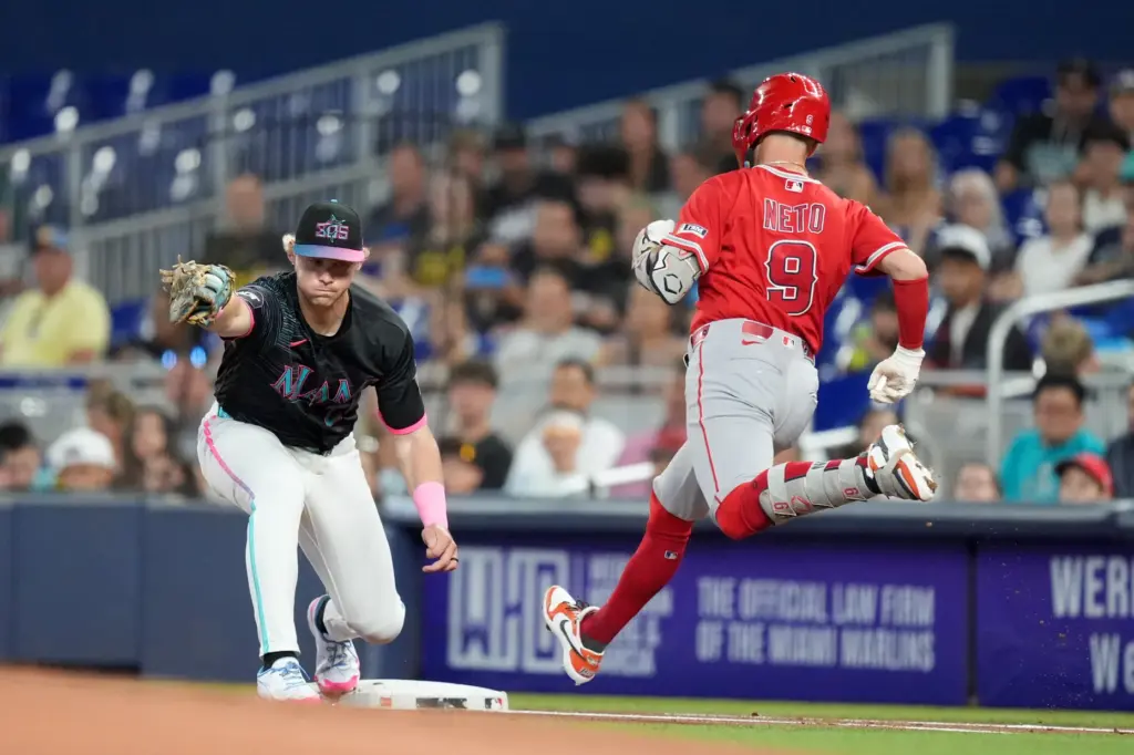 Miami Marlins first baseman Kyle Stowers catches a throw from...