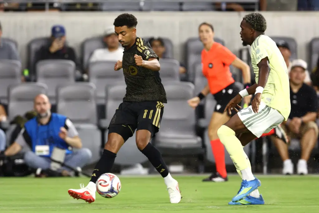 LAFC midfielder Timothy Tillman kicks the ball against the Portland...