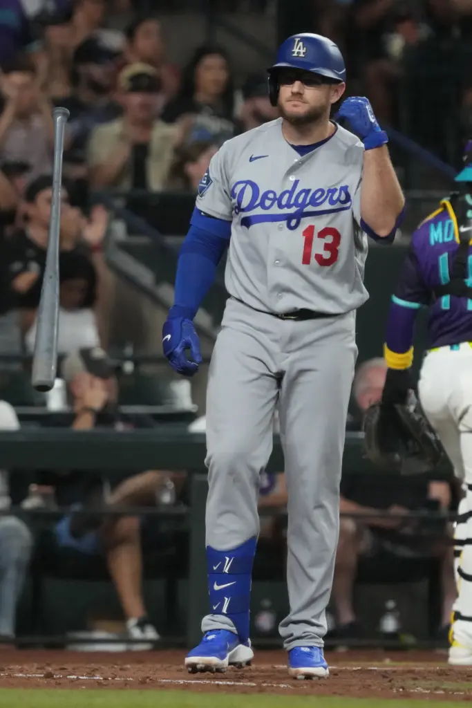 The Dodgers’ Max Muncy tosses his bat aside after batting...
