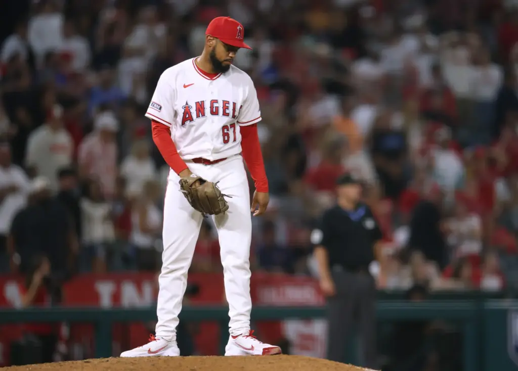 Angels relief pitcher Sammy Peralta shows his frustration after allowing...
