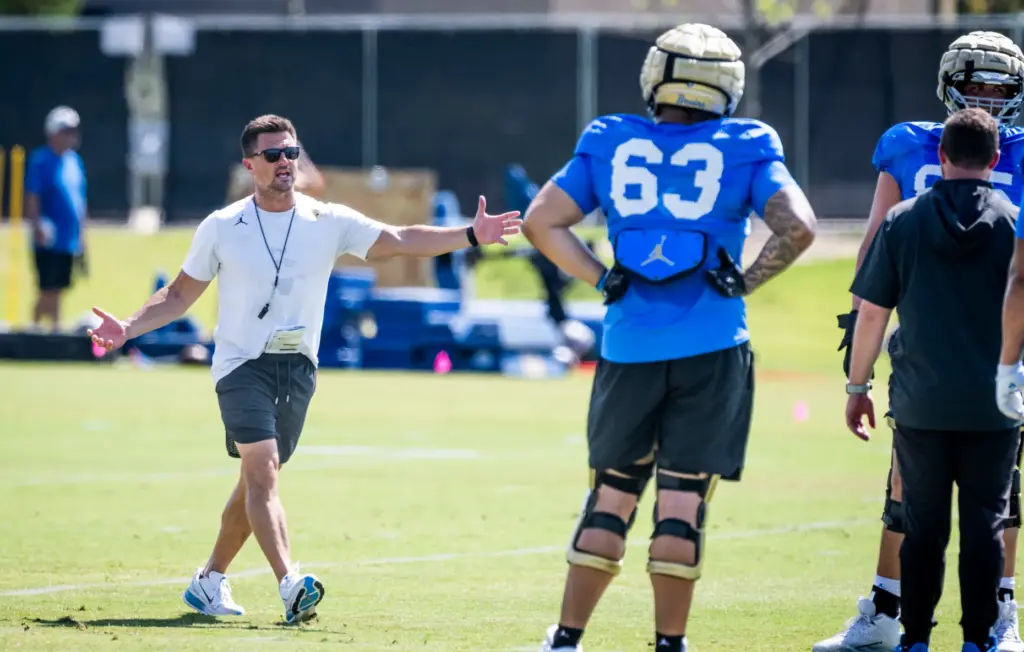 UCLA head coach Bob Chesney talks to players during the...