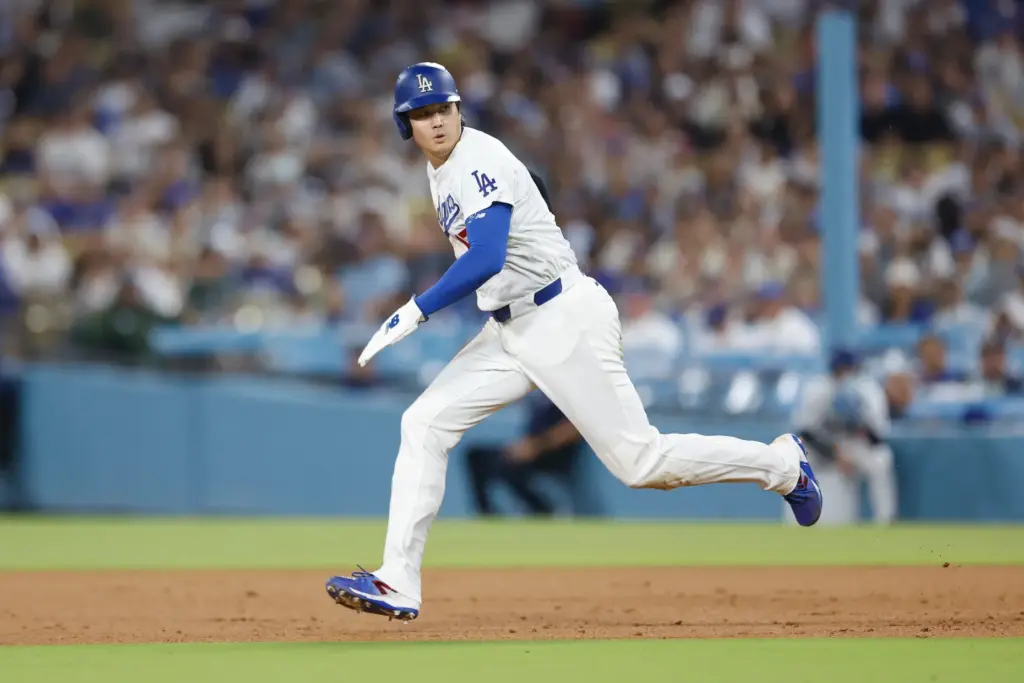 Dodgers star Shohei Ohtani looks over his shoulder as he...