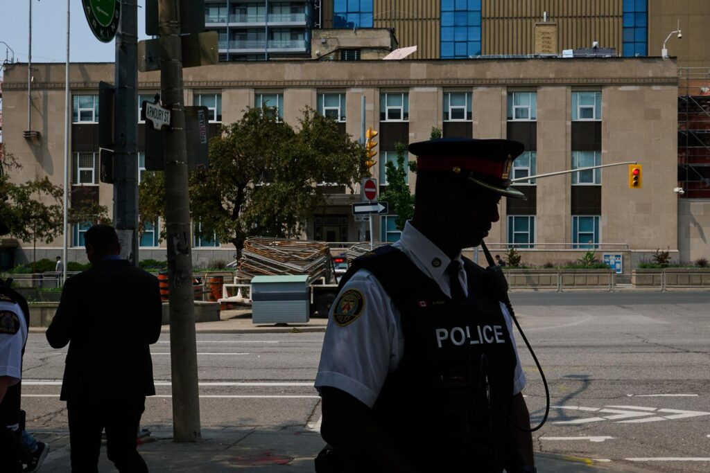 Police leave after speaking to media after a shot was...