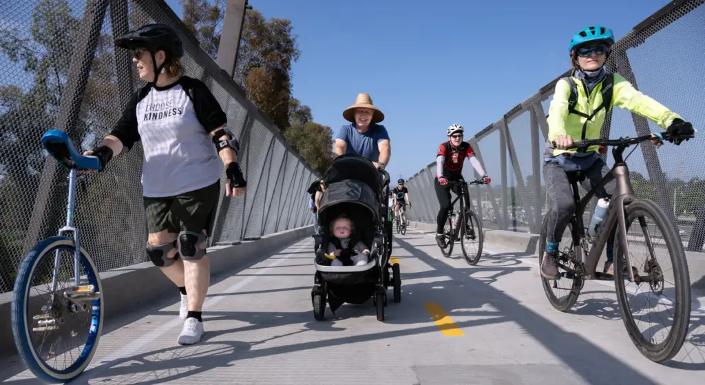 Joe Greeninger strolls with his three grandchildren, including 9-month-old Emma,...