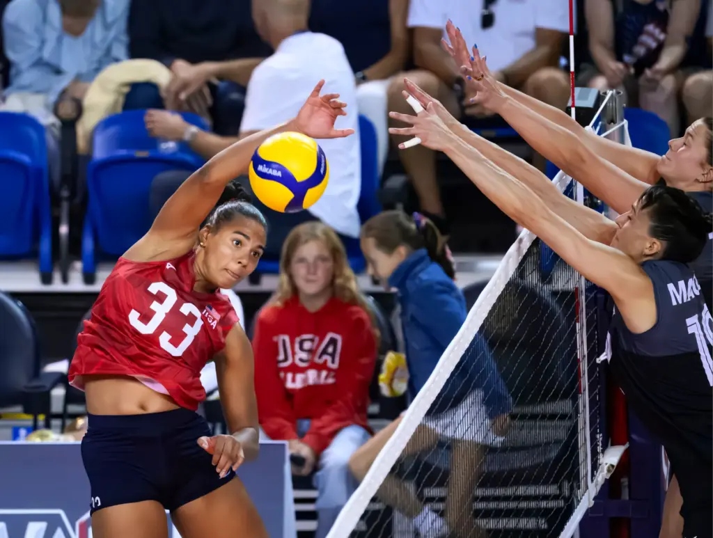 Team USAâs Logan Eggleston hits the ball past Canada defenders...