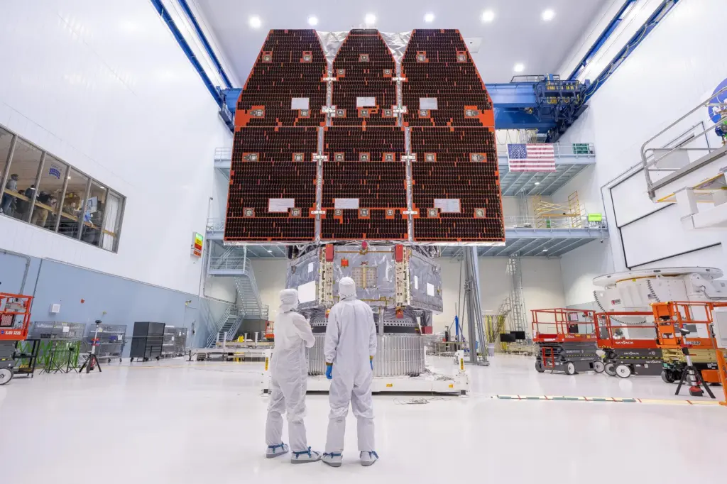 This photo provided by NASA shows technicians connecting the inner...
