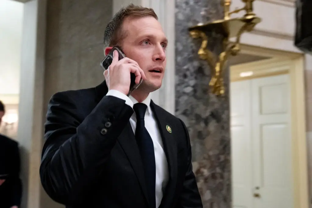 FILE – Rep. Max Miller, R-Ohio, walks out of a...