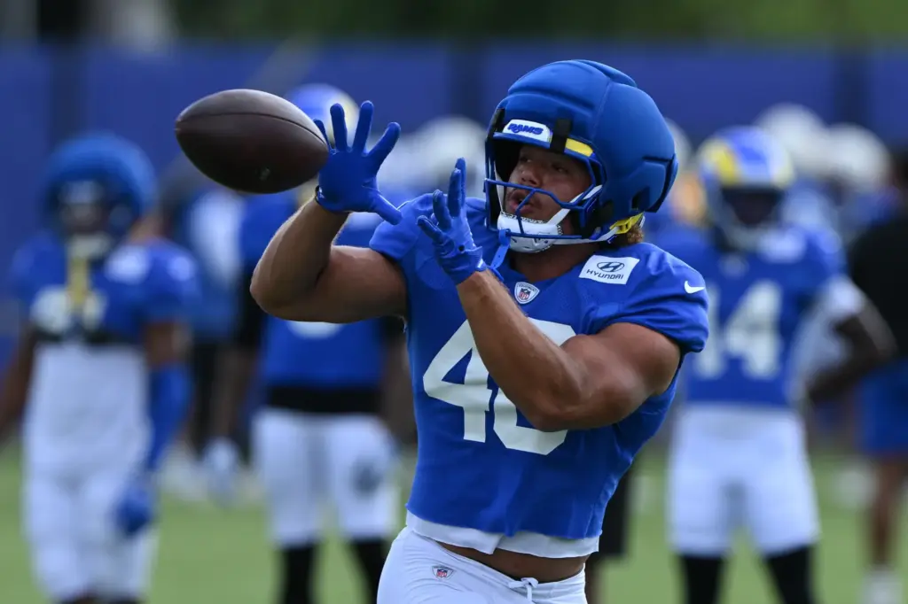 Rams tight end Rohan Jones reaches to catch a pass...