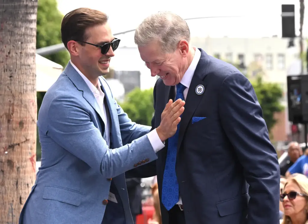 Dodger broadcaster, Joe Davis shares a laugh with Los Angeles...