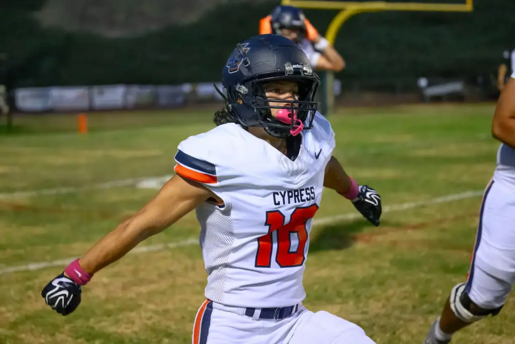 Cypress wide receiver Matt Rodriguez celebrates his touchdown catch against...