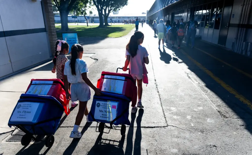 Students take coolers with breakfast for their class at Pacific...
