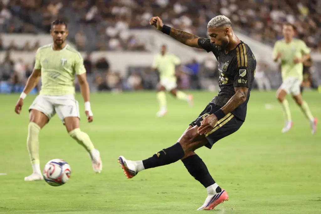 LAFC forward Denis Bouanga takes a shot on goal against...