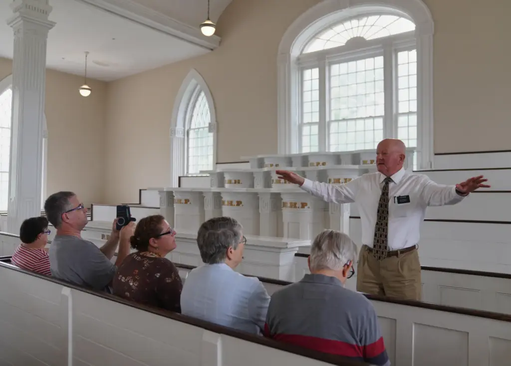 Elder Brian Garner leads a tour of the Kirtland temple...