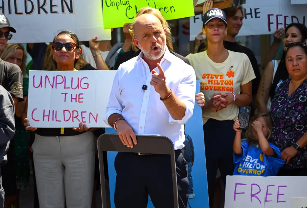 California gubernatorial candidate Steve Hilton holds an outline of a...