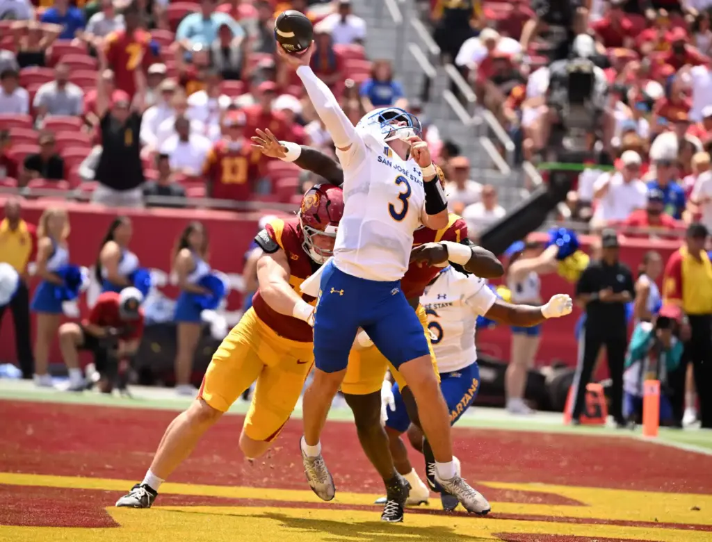 Defensive end Luke Wafle prssures quarterback Luke Weaver (3) of...