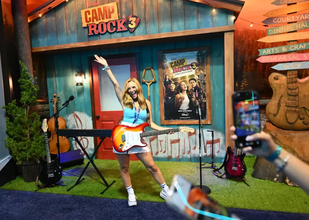 Alice Johnson pretends to play guitar in the Camp Rock...